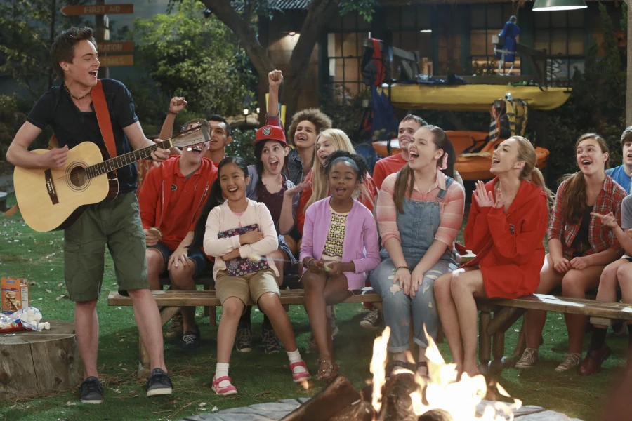 Image Pilot (Xander playing guitar with Tiffany, Zuri, Lou, and Emma laughing) Campfire.jpg