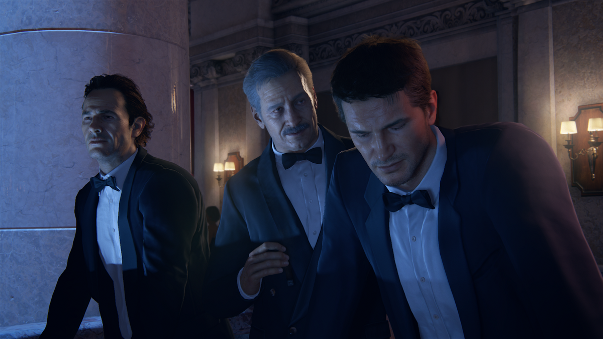 Nathan chatting with suits. 