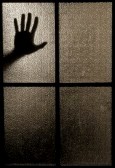 5645061-slightly-blurred-silhouette-of-a-hand-behind-a-window-or-glass-door-symbolizing-horror-or-fear