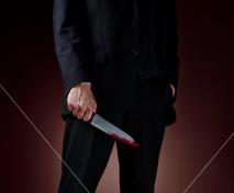 Istockphoto 4565444-man-holding-bloody-knife-over-woman-s-body-lying-on-floor