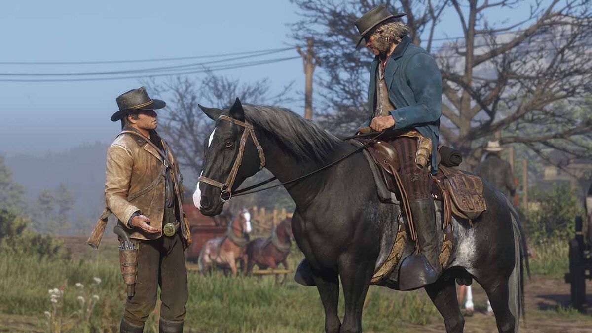 Arthur Morgan in Red Dead Redemption 2 talking to a stranger on a horse.