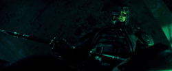 Batman looks down on Superman with the Kryptonite spear