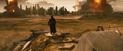 Batman stands over a wasteland