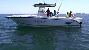 Dexter on his boat with Debra, Cody, and Astor