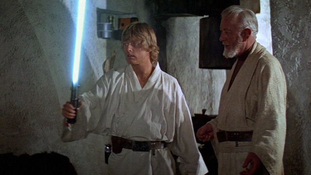 File:LukeHoldingLightsaber.jpeg