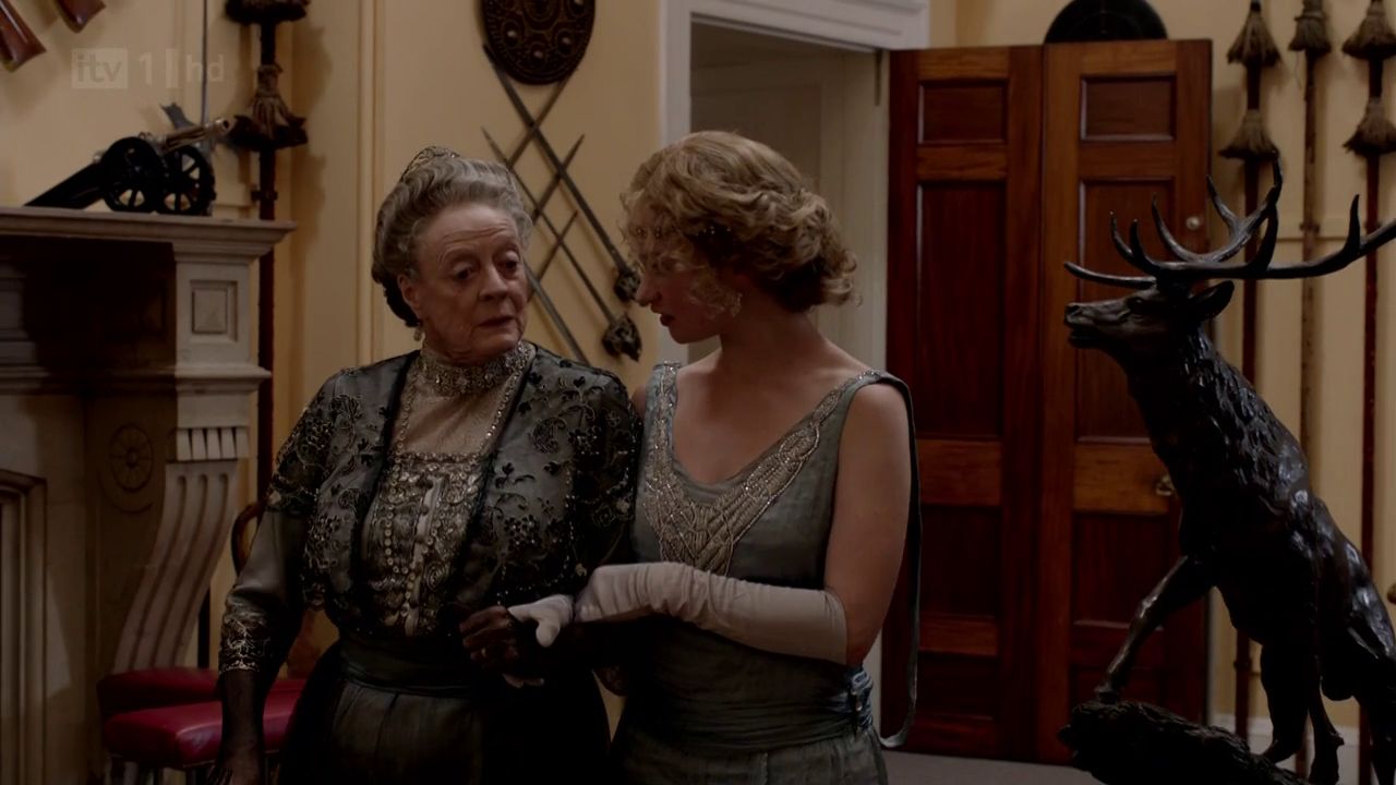 rose aldridge downton abbey wiki fandom powered by wikia man hands a letter to a woman in a hall