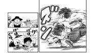 Goku punches the martial artist in the stomach hard