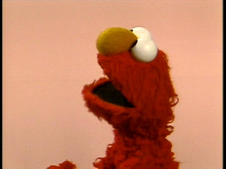 elmo plays peek a boo