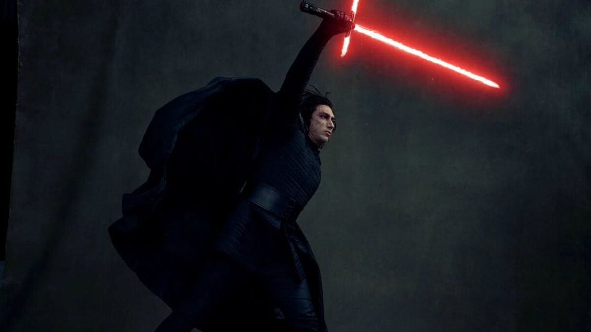 Kylo Ren standing triumphant with lightsaber