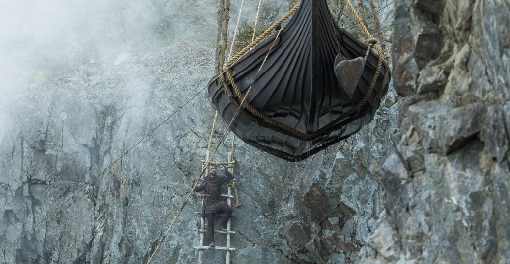 Vikings season 4 Floki supervises the lifting of a boat from a ladder against a rock wall