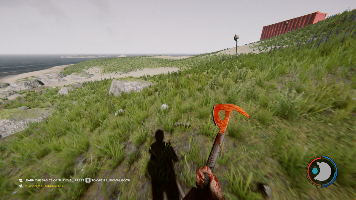 Standing with a bloody axe on a grassy hill.