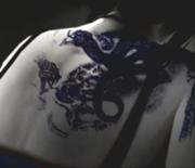 180px-Snakehollytattoo