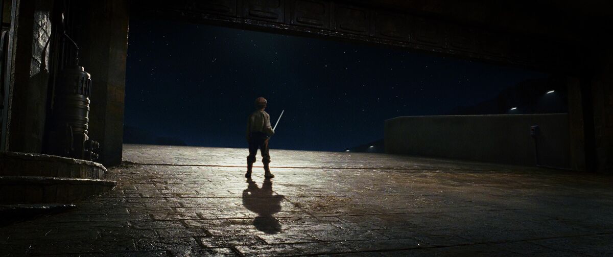 Boy holding a broom and staring at the stars