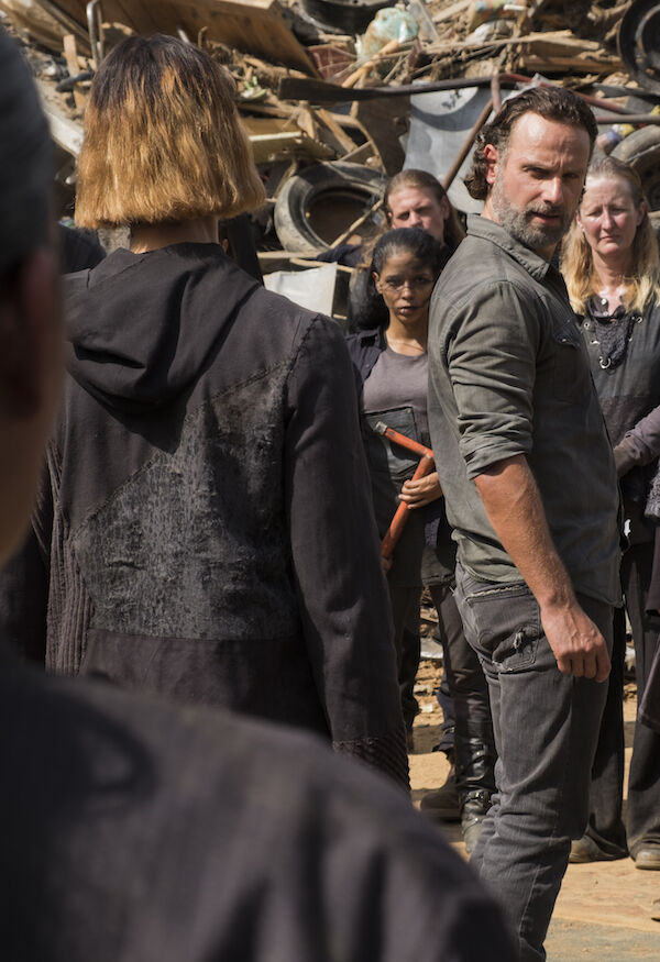 Rick Grimes is surrounded by The Walking Dead junkyard gang.