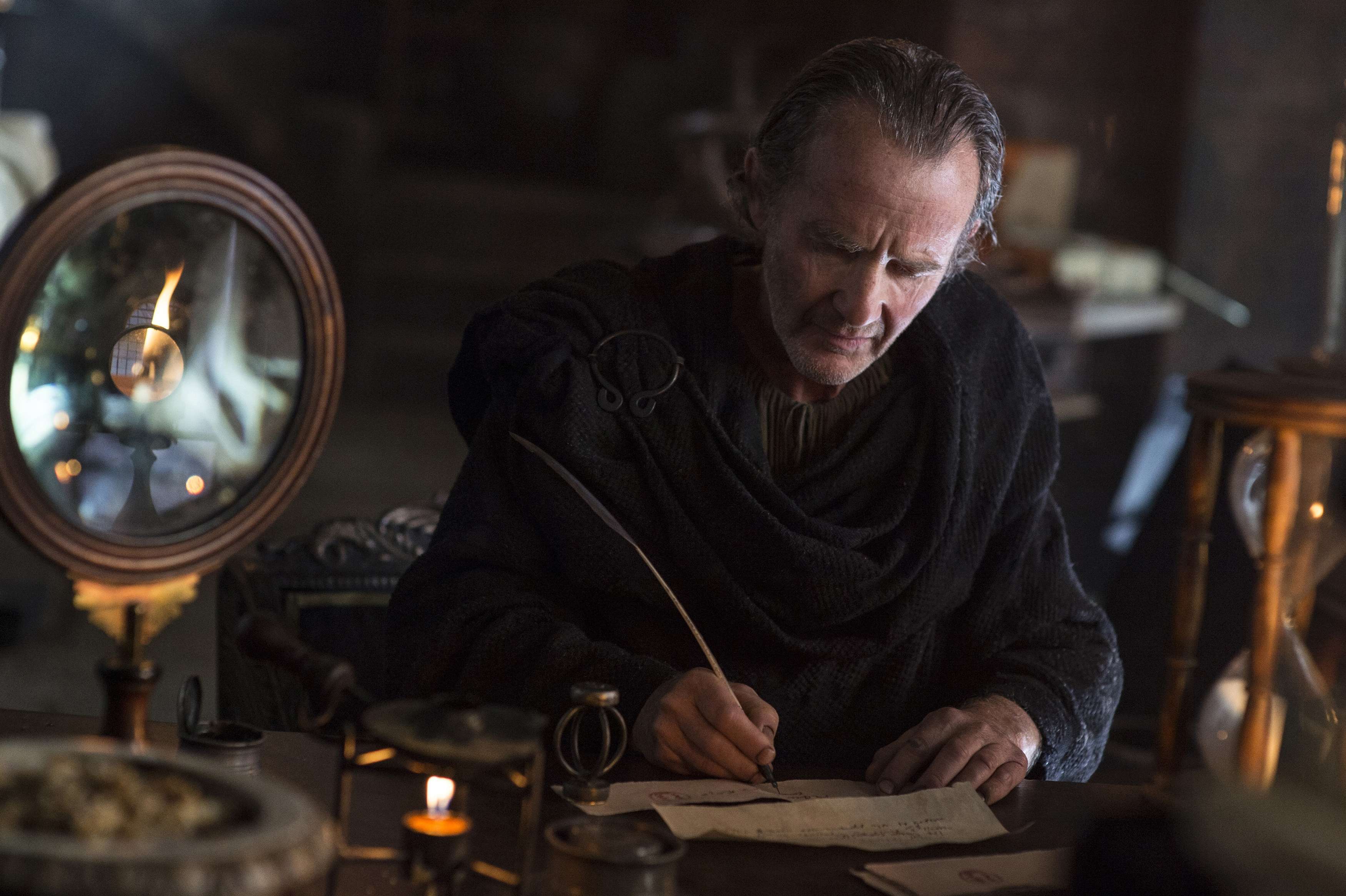qyburn game of thrones wiki fandom powered by wikia man hands a letter to a woman in a hall