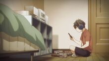 Ritsuka looking at the music album