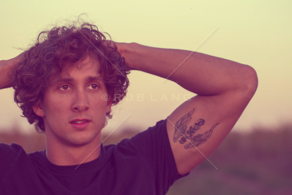 2. Handsome man with curly brown hair and piercing blue eyes - wide 6