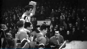 Woody Dumart carried off ice