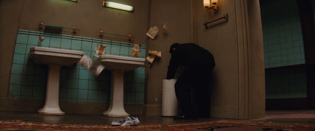 File:Omar searches through trash.jpg