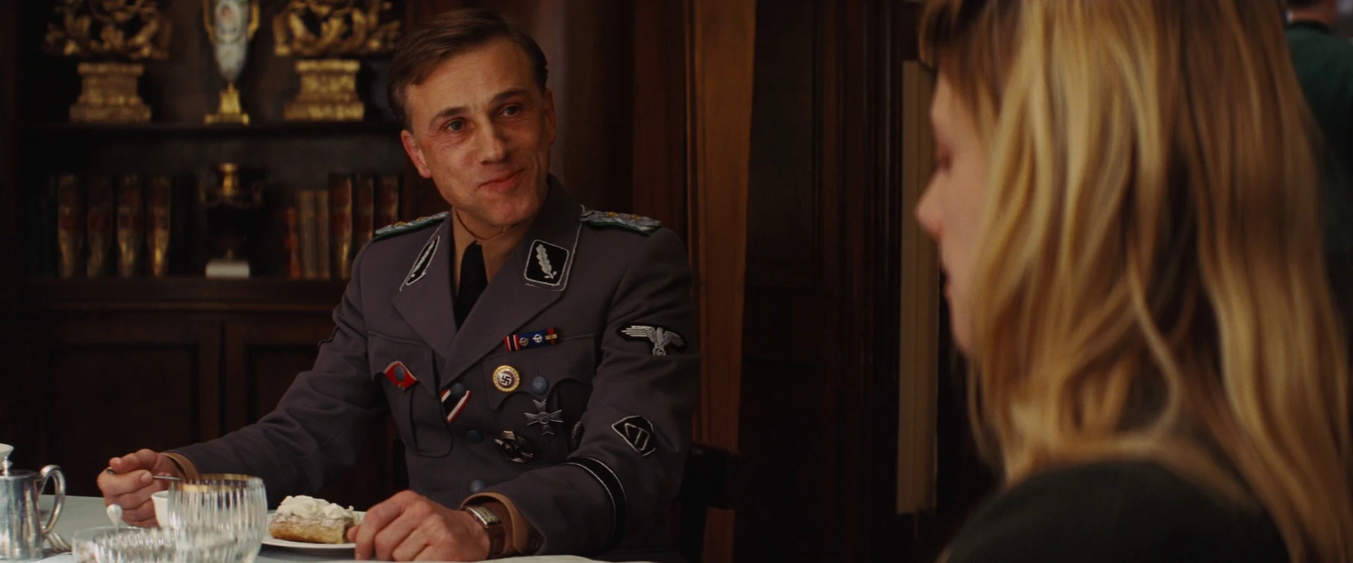 Image Hans Landa looks at Shosanna eating.jpg Inglourious Basterds