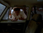 Janeway looks through Lada window