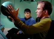 Kirk adjusts automatic scanner