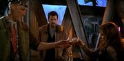 Deanna Troi and Zefram Cochrane toasting