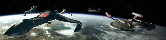 File:Krell's fleet, Enterprise and Columbia over Qu'Vat.jpg
