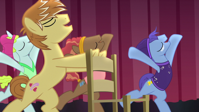 File:Feather Bangs appears on stage with a chair S7E8.png