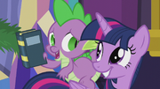 Spike holding a book S5E20