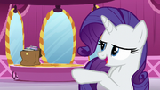Rarity points at a bag filled with books S5E22
