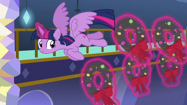File:Twilight Sparkle hanging wreaths as she flies MLPBGE.png