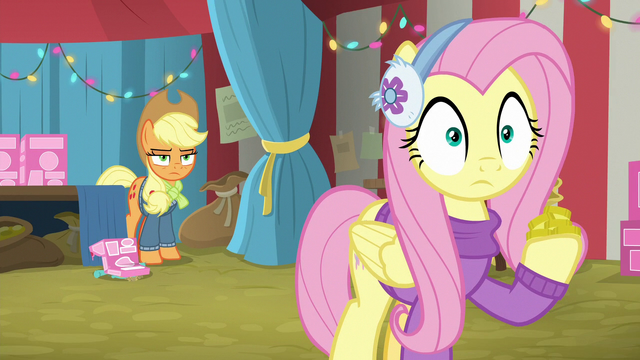 File:Fluttershy holding a hoofful of bits MLPBGE.png