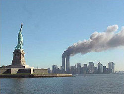 250px-National Park Service 9-11 Statue of Liberty and WTC fire