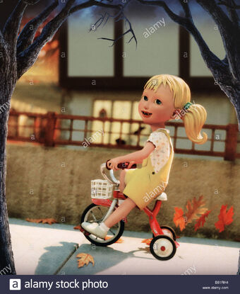 little girl on tricycle