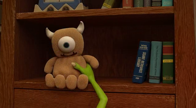 boo monsters inc holding teddy bear