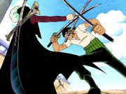 Mihawk hält Zoro mit einem Dolch auf