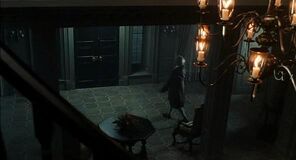 Governor Weatherby Swann's Butler opening the door of the mansion before his death.
