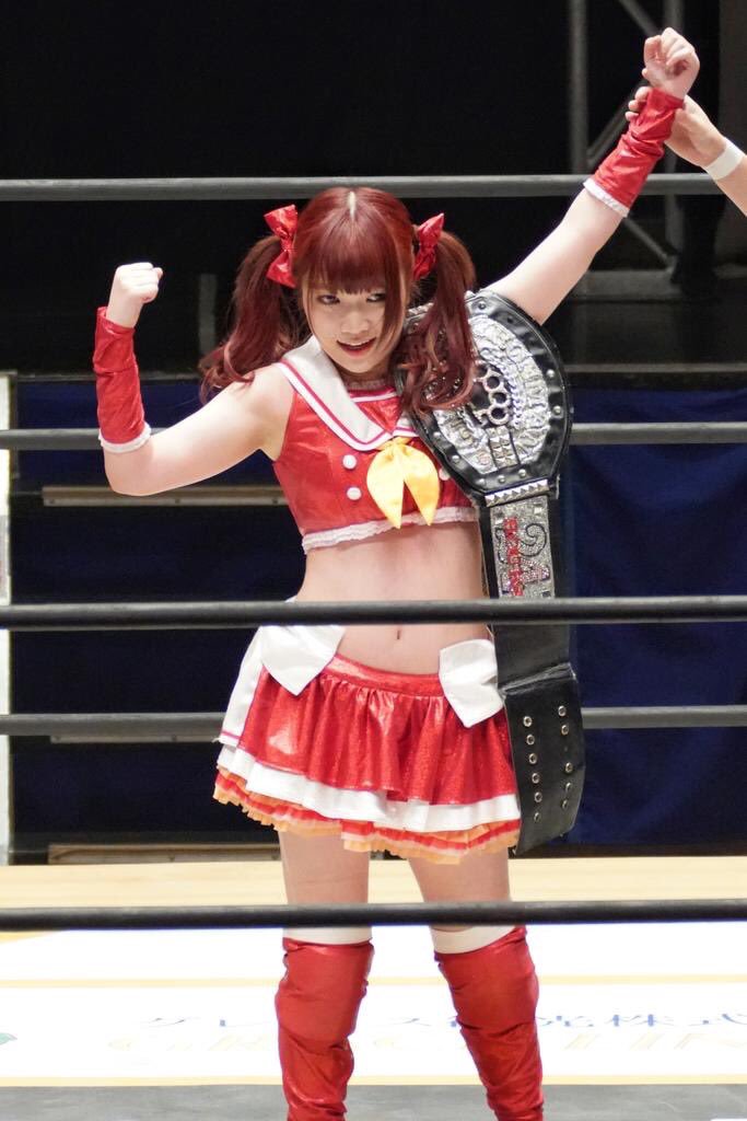 Maki Itoh Posing with the DDT Iron Man Heavy Metal title.