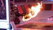 Killalot holds sabretooth over the flame pit