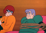 Professor Greer unmasked