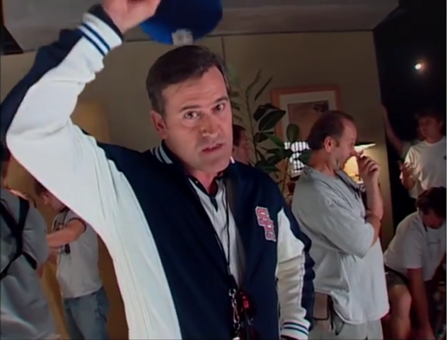 File:Coach Boomer with his hat off.png