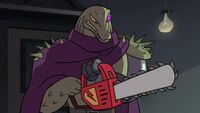 S2E18 Rasticore holding a dimensional chainsaw
