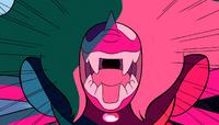 A mouth with sharper teeth appears below a more humanoid mouth.