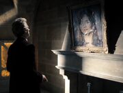 Doctor stares at oil Clara
