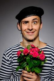 7887006-funny-emotional-romantic-sailor-man-holding-rose-flowers-prepared-for-a-date