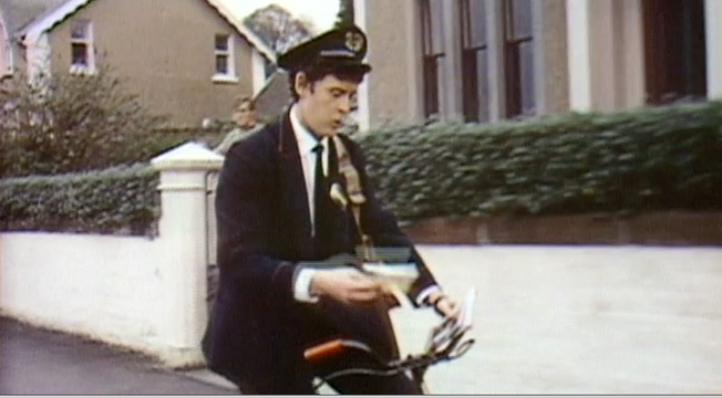Postman riding by