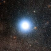 The bright star Alpha Centauri and its surroundings
