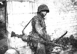 Waffen-SS Officer in Caen with an MG 42, 1944