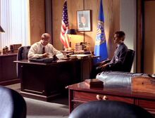 Walter Skinner sits with Fox Mulder